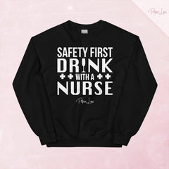 Safety First Drink With A Nurse Graphic Crewneck Sweatshirt — Black
