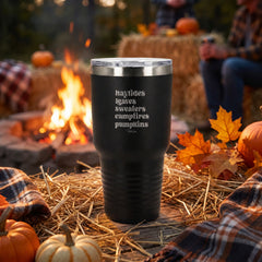 Black 30oz engraved Tundra tumbler engraved with “Hayrides Leaves Sweaters Campfires Pumpkins” in a dusk autumn campfire…