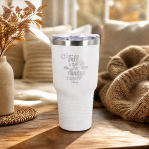 White 30oz engraved Tundra tumbler engraved with “Fall Is Proof That Change Is Beautiful” in a elegant autumn garden path…