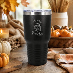Black 30oz engraved Tundra tumbler engraved with “Howdy Pumpkin” in a rustic Western fall porch lifestyle