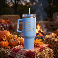 Light Blue 40oz engraved travel tumbler engraved with “Hayrides Leaves Sweaters Campfires Pumpkins” in a dusk autumn…